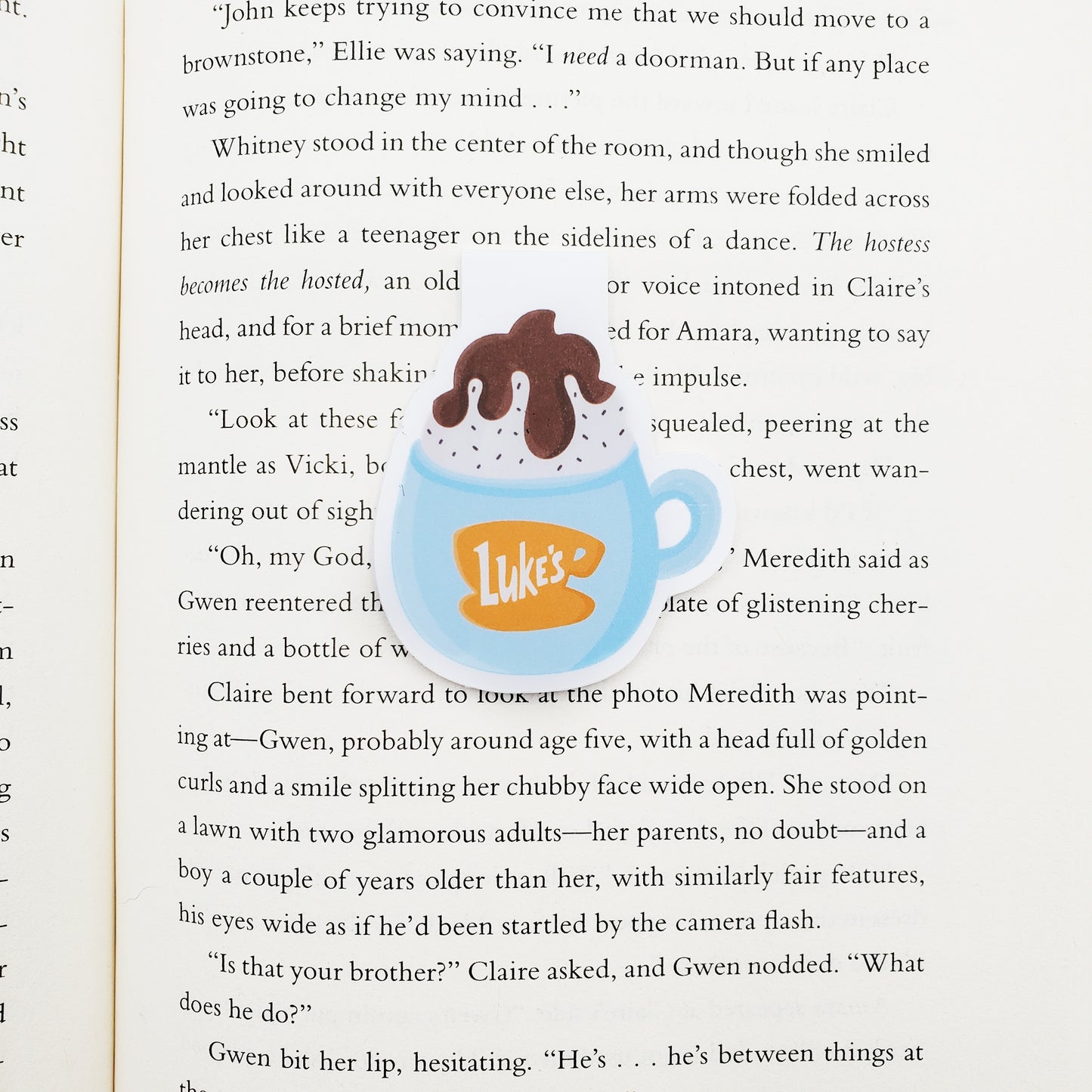 Illustration of a blue mug with 'Luke's' logo on a book page
