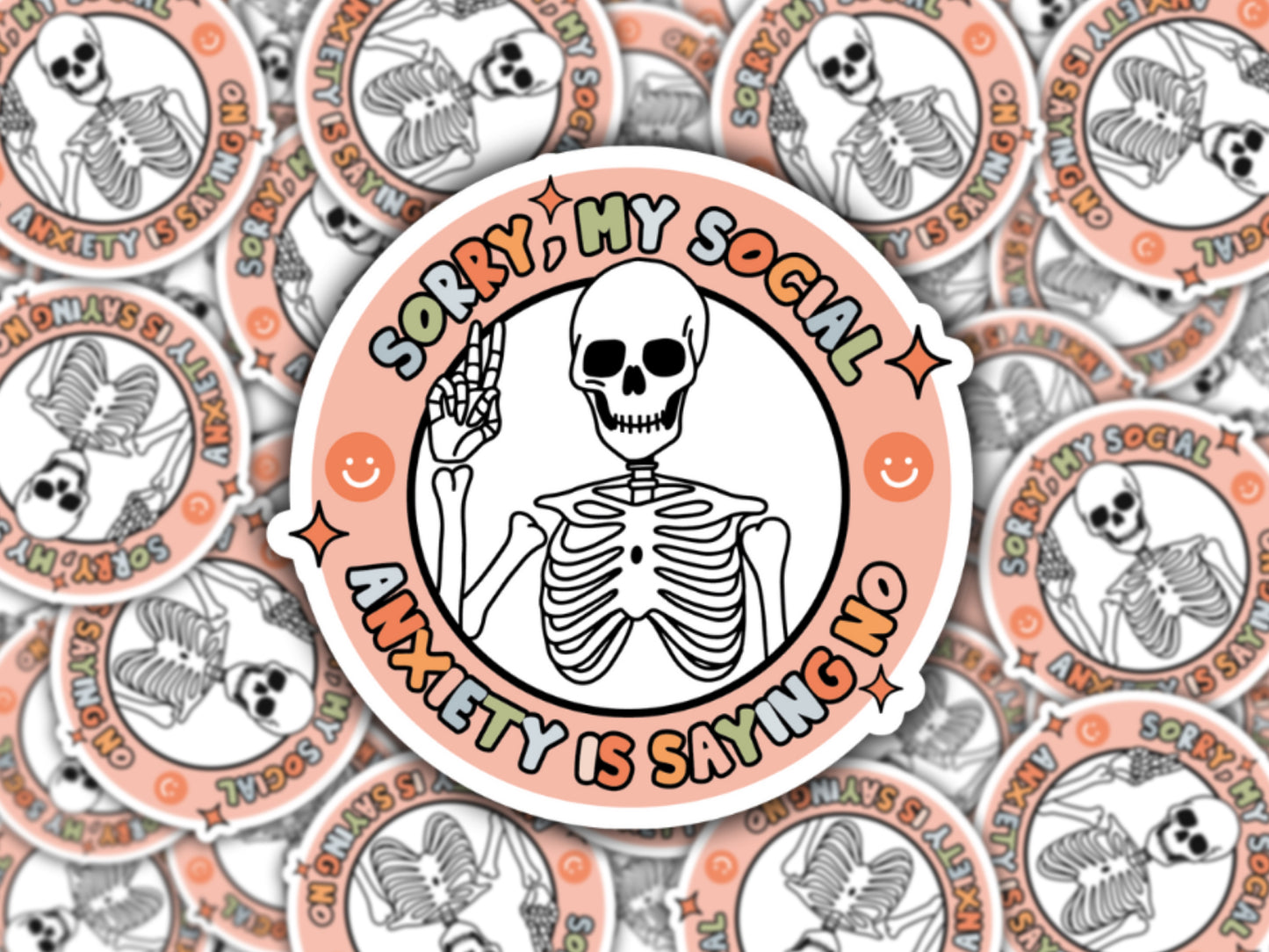 A sticker with a skeleton design and the text 'Sorry, my social anxiety is saying no' in a circular arrangement, with multiple stickers of the same design displayed around it.