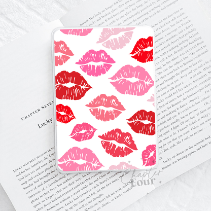 E-Reader case with red and pink lipstick prints, on a book page background