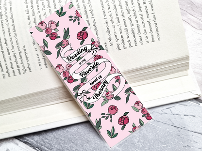 Floral bookmark with 'Reading is my favorite kind of therapy' text on a book