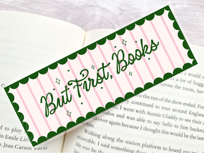 Bookmark with 'But First, Books' text laying on a book page