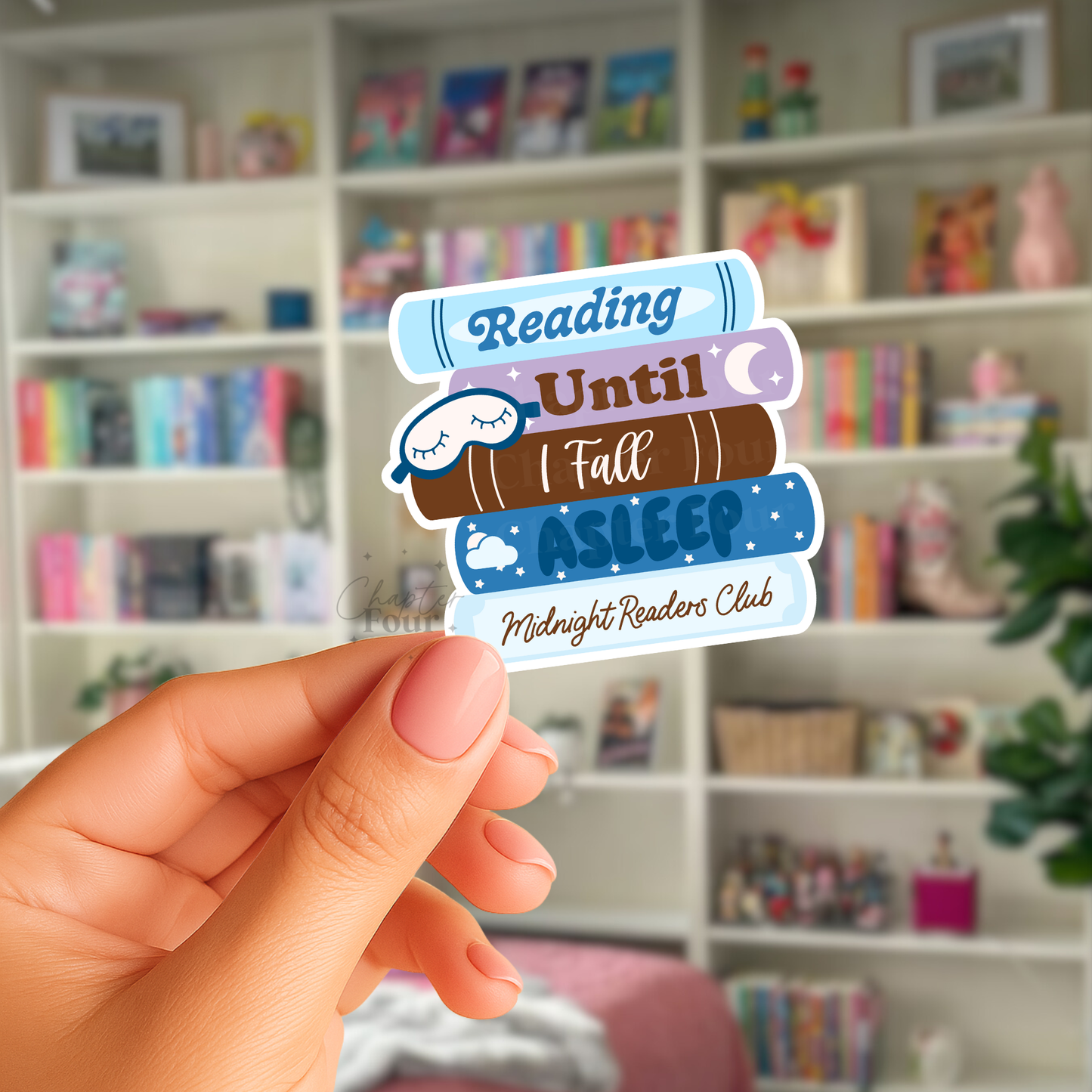 Blue bookstack sticker with 'Reading Until I Fall Asleep Midnight Readers Club' text held in front of a bookshelf.