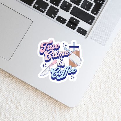 Sticker with 'True Crime & Coffee' text, laying on a laptop
