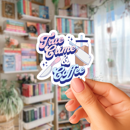 Sticker with 'True Crime & Coffee' text held in front of a bookshelf.