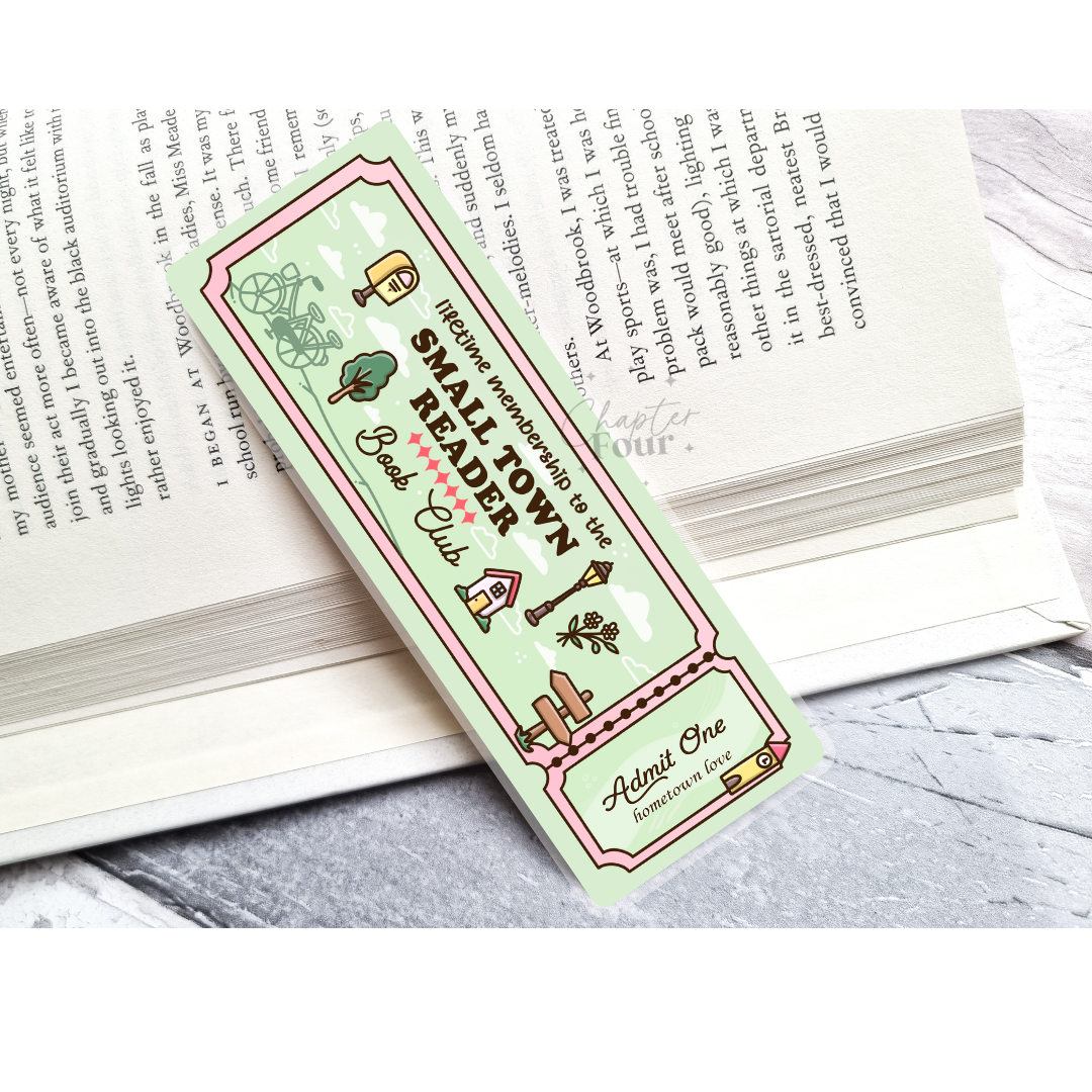 Green bookmark with 'Small Town Reader Book Club' design on an open book