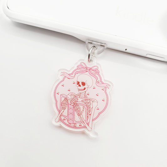 Pink Skelly Reads Double-Sided Dust Plug Charm