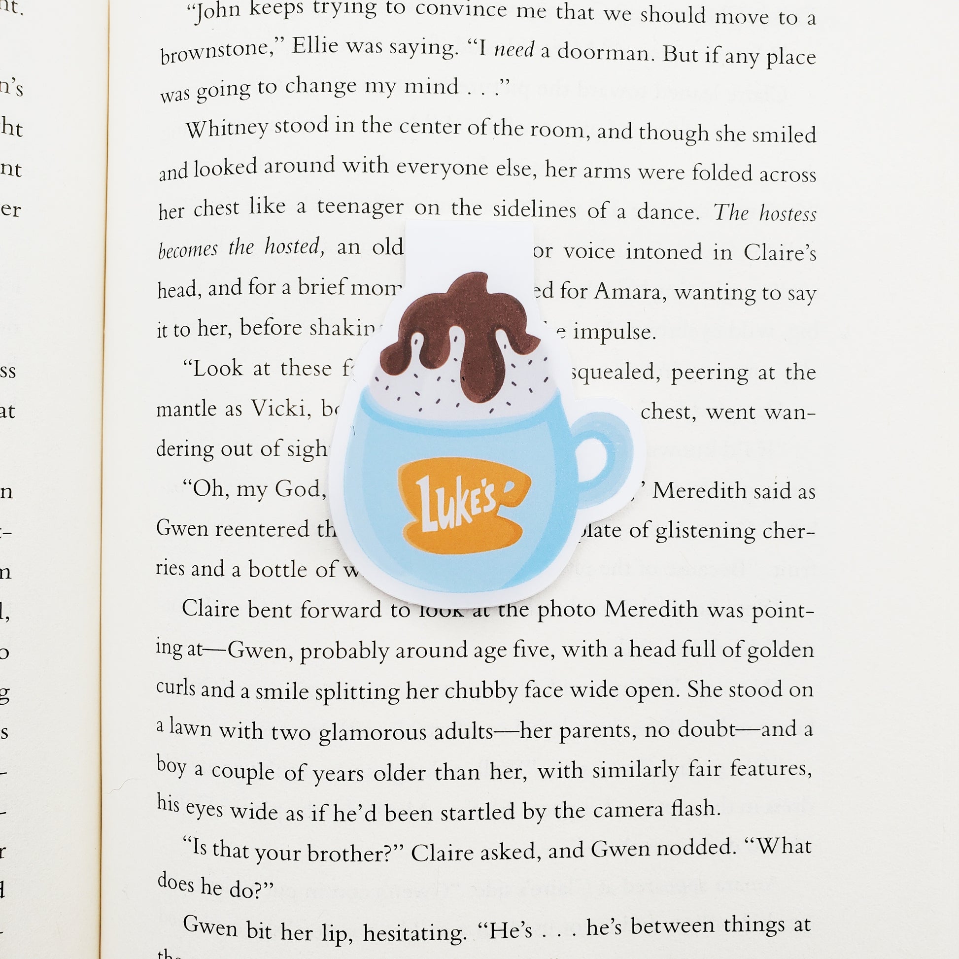 Illustration of a blue mug with 'Luke's' logo on a book page