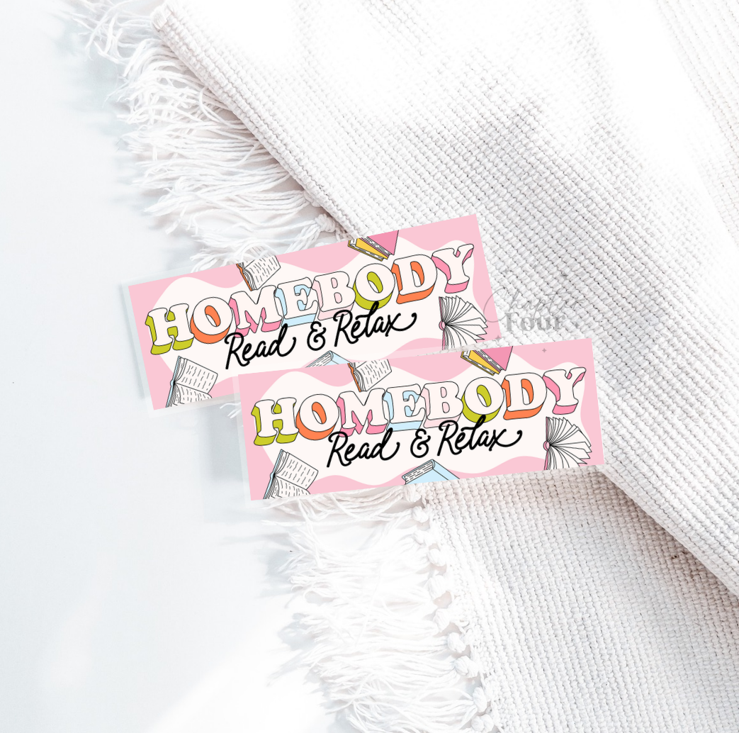 Two 'Homebody Read & Relax' bookmarks on a textured white surface